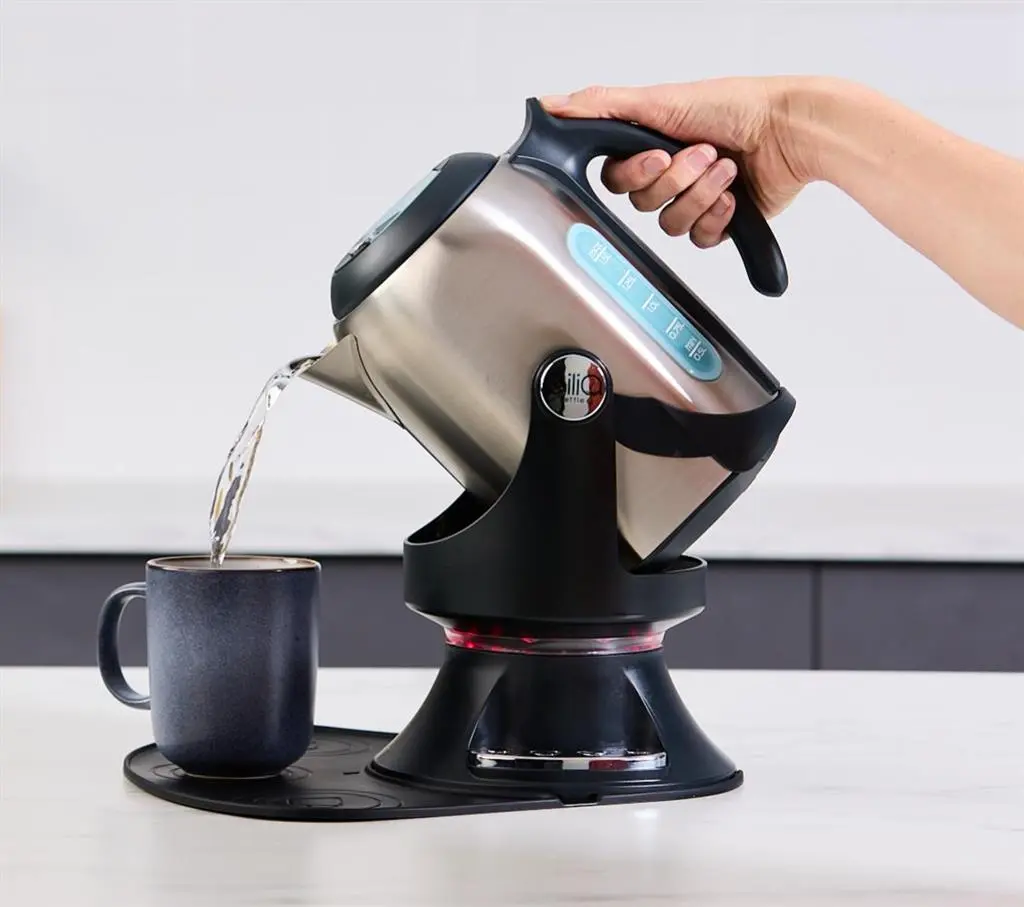 Gilia tipping kettle on its swivel base, BPA-free plastic and stainless steel
